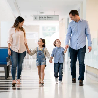 service 1 happy family walking at the primary care hallway